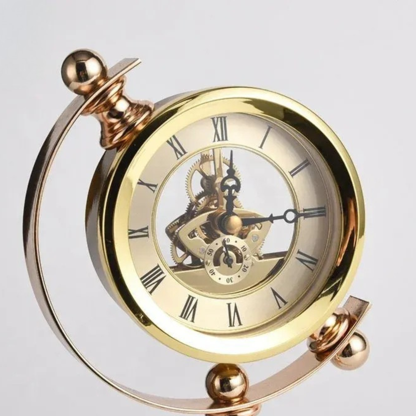 Goldene Tripod-Tischuhr aus Metall